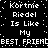 Black background with white pixelated text repeating 'Kortnie Riedel Is Like My BEST FRIEND' in a pattern, surrounded by scattered white dots