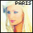 Pixelated static icon of a stylized female face with blonde hair and blue eyes, featuring the word "PARIS" in blocky text at the top against a light yellow background.