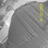 A static pixelated image shows a gray textured surface with diagonal lines and a vertical yellow strip on the right side, set against a light gray background.