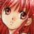 Pixelated cartoon-style icon of a character with red hair and large eyes, static single-frame image.