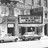A grayscale pixelated image shows a rectangular frame with internal divisions and a smaller adjacent shape, all on a textured background.