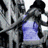 Pixelated image of a person in purple clothing on the left, with blue background and pixelated text reading 'music gives rhythm' on the right.