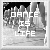 Pixelated grayscale image with bold white text 'DANCE IS LIFE' overlaid on a cityscape background featuring buildings and dark sky elements.