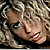 six pixelated images showing a woman with curly blonde hair, each displaying different facial expressions and text overlays in pink font