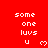 Red background with white pixelated text 'some one luvs u' and a heart symbol, arranged in multiple