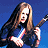 A pixelated contact sheet showing two frames of an animated icon featuring a woman with long brown hair playing electric guitar against blue background, next to green text reading "Original Icons .com" on dark green background.