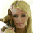 A 4-frame contact sheet of a blonde woman holding a small dog, with red text in the bottom-right corner.