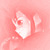 Pixelated pink-toned image of a stylized hand gesture with fingers curled inward, set against a soft gradient background.