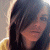 A static image shows a person with long dark hair against a light background, next to green text reading 'Original Icons .com' on a solid dark green field.