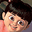 Pixelated close-up of a person with dark hair, light skin, and a smiling expression, wearing a pink garment against a dark background.