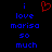Pixelated text reads 'i love moriso so much' in blue with a red heart symbol above the 'i' on a black background.