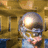 Animated icon shows a metallic helmeted figure with glowing eyes against a golden background, head turning from left to right.