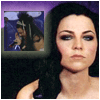 A static avatar shows a woman with dark hair and blue eyes against a purple background, with a small inset image of another person singing.