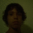 A pixelated image of a person with dark hair against a greenish background, with red text reading "I <3 you Timmy :]" and "11-27-07" on black and gray