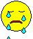 Yellow circular face with closed eyes and red mouth, multiple cyan tears falling from different positions on the face.