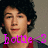 Pixelated image of a person with dark hair wearing red clothing, overlaid with pink text reading 'lottie' and a heart symbol.