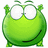 Green cartoon character with large white eyes and a smile on a white background, next to red background with partial text.