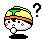 Pixelated cartoon character with yellow hair, green topknot, orange headband, red cheek marks, and black base; mouth alternates between open and closed states.