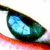 A close-up of a blue-green cat eye with red eyelid, showing subtle animation changes across four