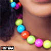 repeated images showing a person wearing a beaded necklace with colorful round beads, with the word 'VINTAGE' in the top-left corner of each