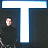 A static pixelated image shows a person in dark clothing standing behind a large white 'T' shape with blue borders on a dark background.