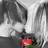 A grayscale anime-style character with long hair holds a red flower, while red text appears in the upper right corner.