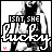 A black-and-white pixelated image of a person in a dark top with pink accents, overlaid with text reading "GOT SHE LUCKY" and small pink hearts.