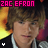 Static pixelated image of a person with brown hair and light skin wearing a dark jacket over a white shirt, overlaid with bright pink text reading "ZAC EFRON" at the top against a dark background with yellow/orange gradient on the left side.