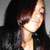 A person with long dark hair and a black top appears in three showing slight head movement against a gray background