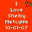 Red background with white pixelated text reading "I Love Shelby Metcalfe 10-01-07" and a green heart symbol above the word "Love", displayed in two identical side-by-side