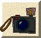 Pixelated camera icon with brown strap, blue lens, red top button, and lightbulb symbol on top, showing sequential flash animation.