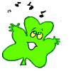 Green four-leaf clover character with yellow eyes and open mouth, surrounded by black musical notes in three of three