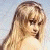 A pixelated contact sheet showing two frames of an animated icon featuring a blonde woman on the left and green text reading "Original Icons .com" on the right against a dark background.