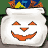 Animated sequence of white sack-shaped icons with orange jack-o'-lantern faces against a green and blue background, showing variations in facial expressions and contents.