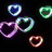 Animated icon with floating heart shapes on black background, transitioning to rainbow stripes and text overlays.
