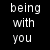 Black background with white text surrounding a central image of two people, one with long curly hair and the other with dark hair.