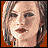 Pixelated of a woman's face with horizontal black bars, displaying 'TORQUE' text in silver and white on black background