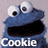 Two side-by-side frames of a blue Cookie Monster character with large white eyes and black pupils, each frame showing the same character with different text below its mouth on a gray background.