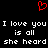 Red pixelated heart symbol above white text reading 'I love you I love you is all is all she heard she heard' on black background.