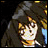 Pixelated image of a character with long dark hair and a hooded cloak against a dark background with yellow and blue accents.