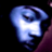Pixelated blue and white icon with a stylized letter R shape on black background, featuring gradient shading and soft edges.