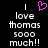 Pixelated text reads 'I love thomas sooo much!!' with a pink heart symbol above the first 'I', displayed on black background.