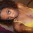 Pixelated close-up of a character with light skin, dark hair, and a yellow garment, showing partial facial features and clothing details.