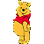 Pixelated yellow bear with black nose and eyes, wearing red scarf, standing upright against white background.
