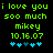 Green pixelated text on black background reads 'i love you soo much mikey 10.16.07' with blue heart symbols below, two identical frames show animation change in heart positions.