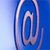 A metallic paperclip icon with a blue gradient background, rendered in a pixelated style with light and dark blue tones.
