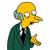 Pixelated yellow-skinned character with large round eyes, wearing a dark green suit and black tie, holding up one hand in a gesture.