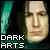 Pixelated image with teal vertical bar on left, light-skinned face on right, and white blocky text reading "DARK ARTS" at bottom left.