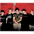 Group of people in various poses with text overlays, transitioning from color to black-and-white and back to color.