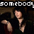 A pixelated animated image shows a woman in dark clothing with long hair, making hand gestures against a dimly lit background with text overlays.
